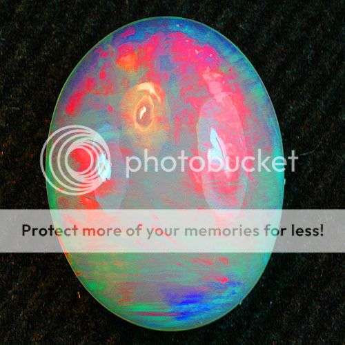 OUTSTANDING OPAL!!!  2.61CT. OVAL FACET 100% NATURAL ELECTRIC RED RAINBOW PLAY DELANTA  WELO OPAL
