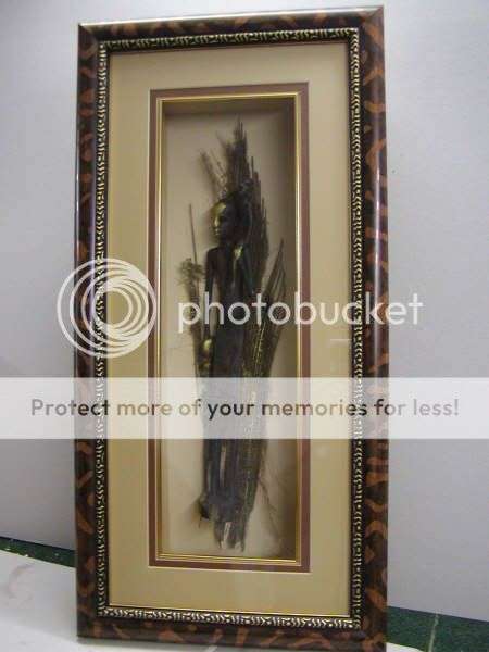 African Figure with gold highlights on palmbark