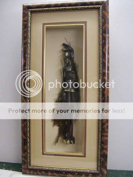 African Figure with gold highlights on palmbark