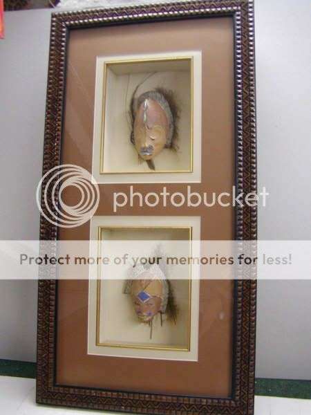 African masks on palm bark