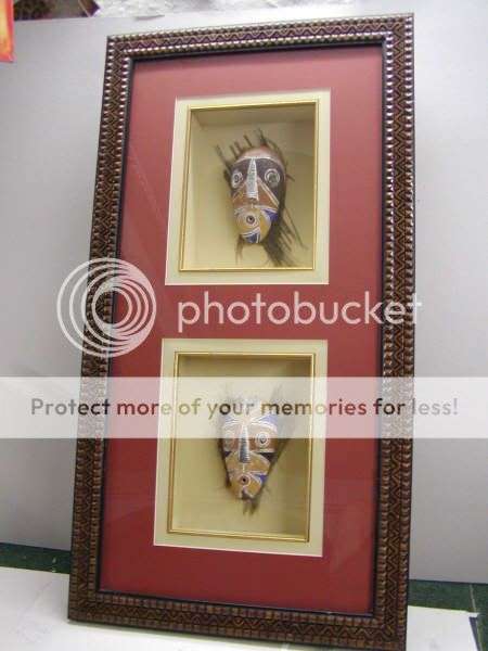African masks on palm bark