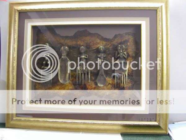 Antique African combs with gold highlights on handmade paper