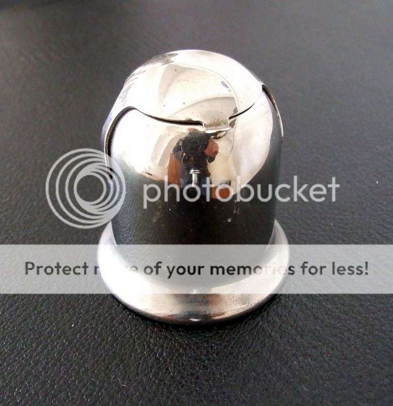 An old chrome capstan inkwell