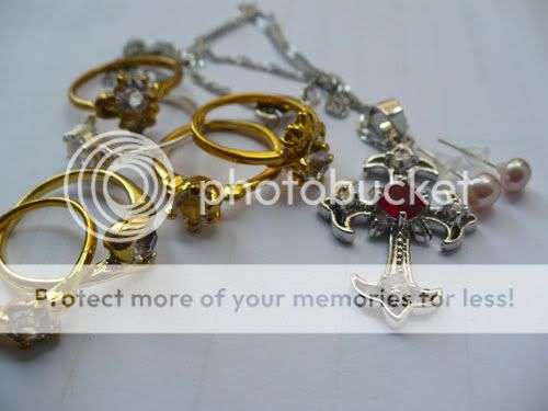 Set of 6 Rings a Gold Plated Cross Necklace and Pearl Earrings