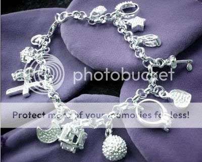 STERLING SILVER STUNNING 13 CHARM BRACELET