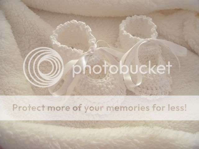 Beautiful white hand crocked baby booties