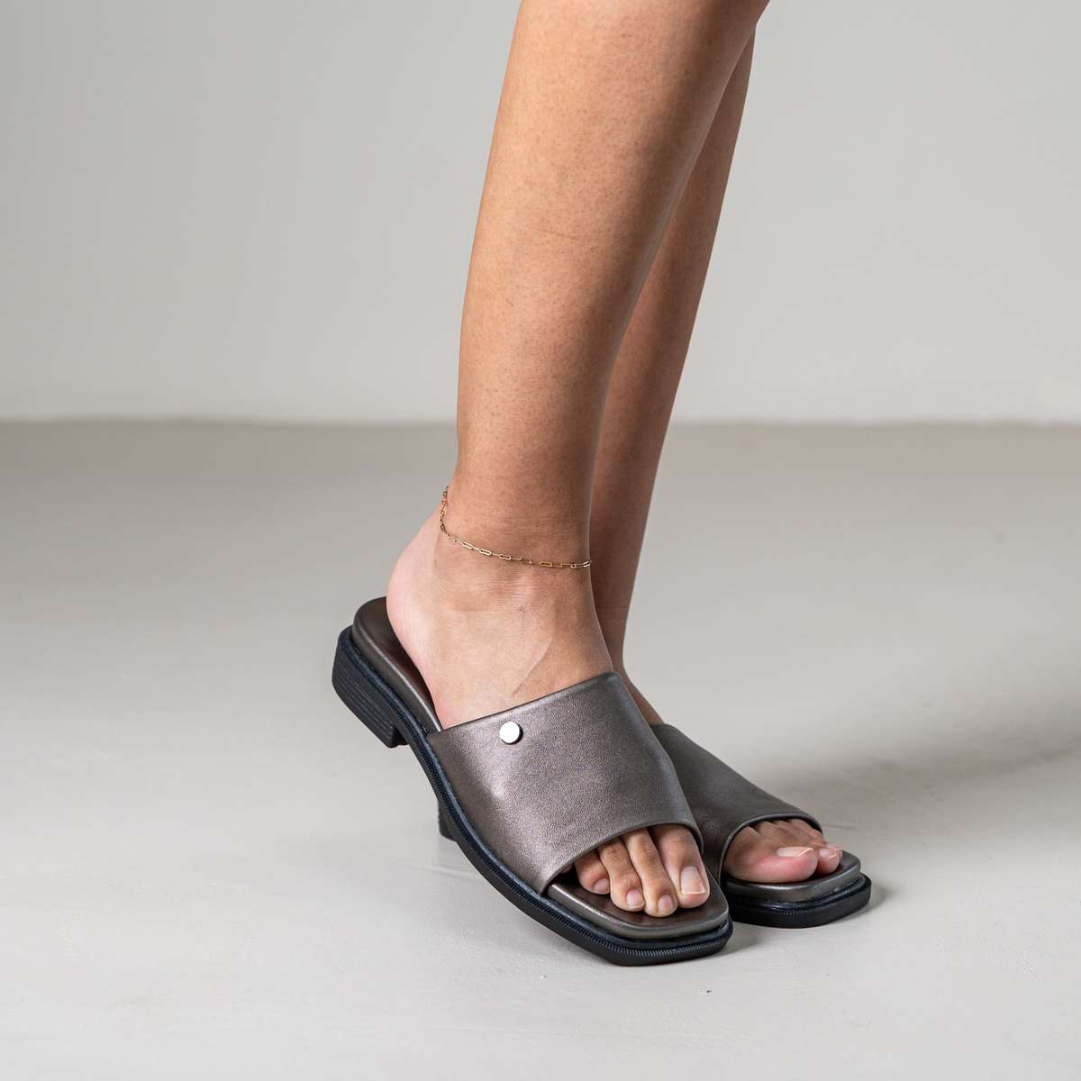 Marley slip-on sandal with front metal stud