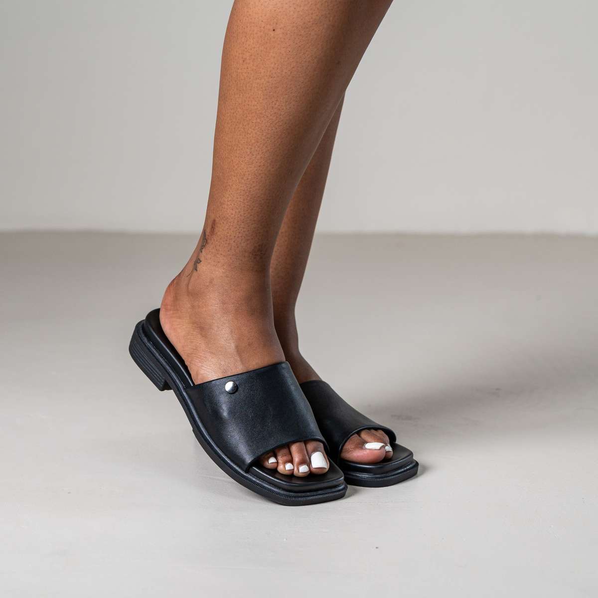 Marley slip-on sandal with front metal stud