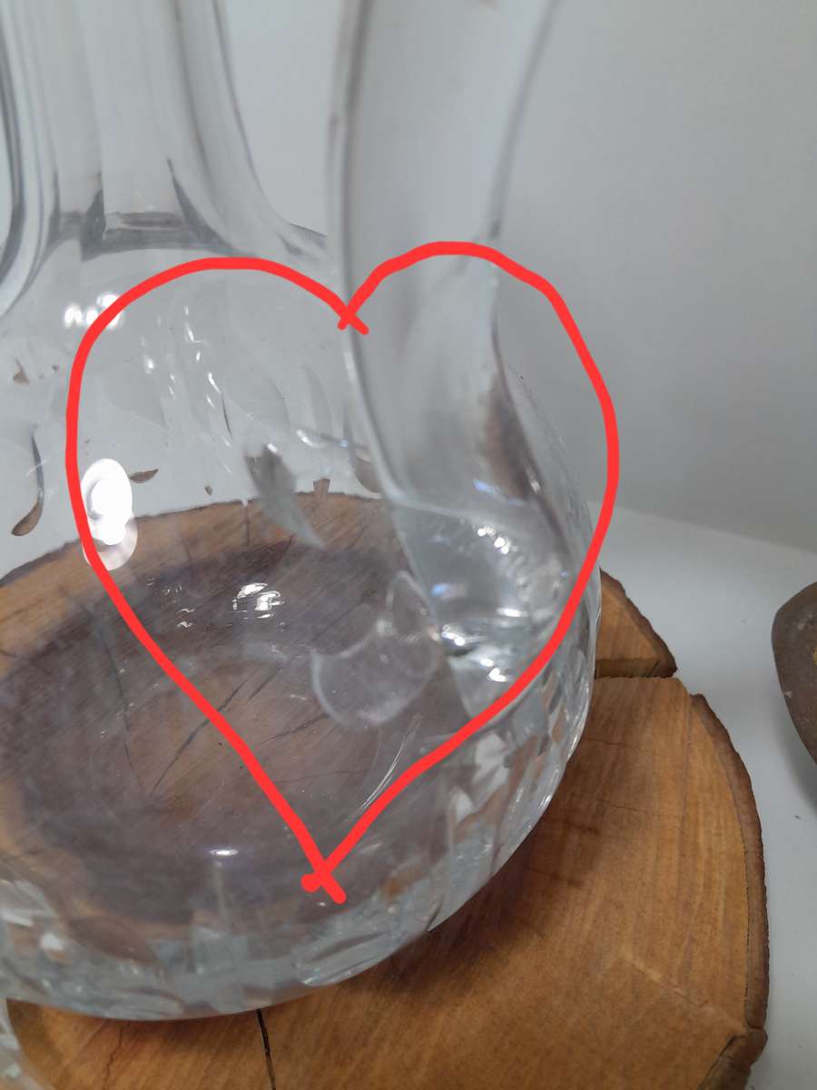 A Handled Crystal Decanter with Multifaceted Stopper