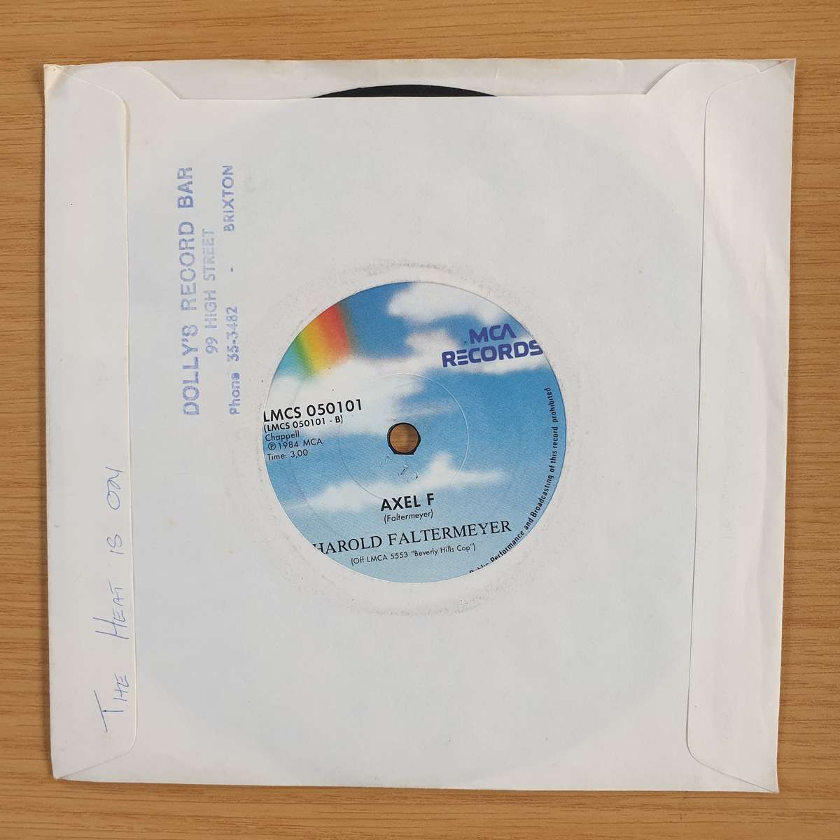 Glenn Frey / Harold Faltermeyer  The Heat Is On / Axel F | Vinyl 7" Single | (VG+)