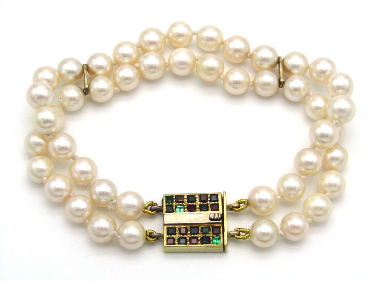 Mid-century, 18K gold double-strand cultured pearl, ruby, sapphire and emerald bracelet