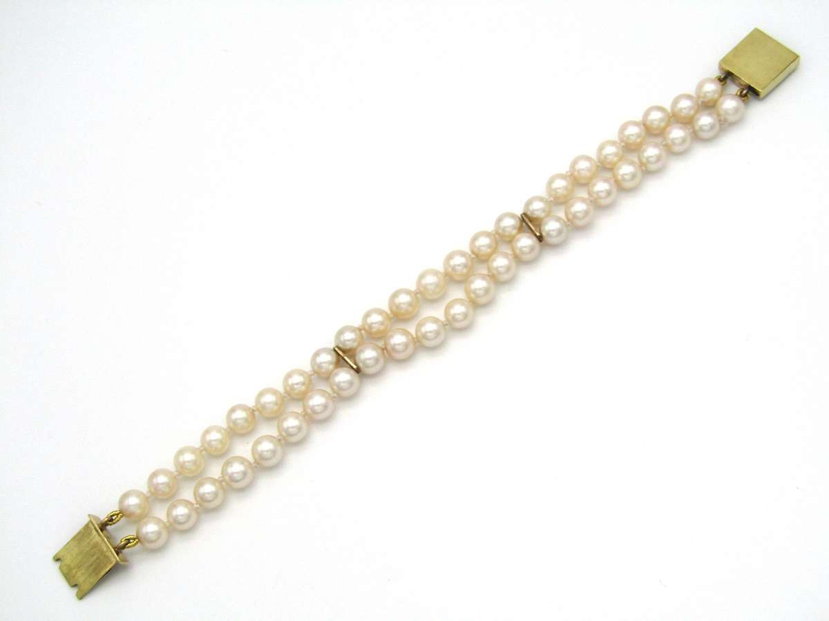 Mid-century, 18K gold double-strand cultured pearl, ruby, sapphire and emerald bracelet