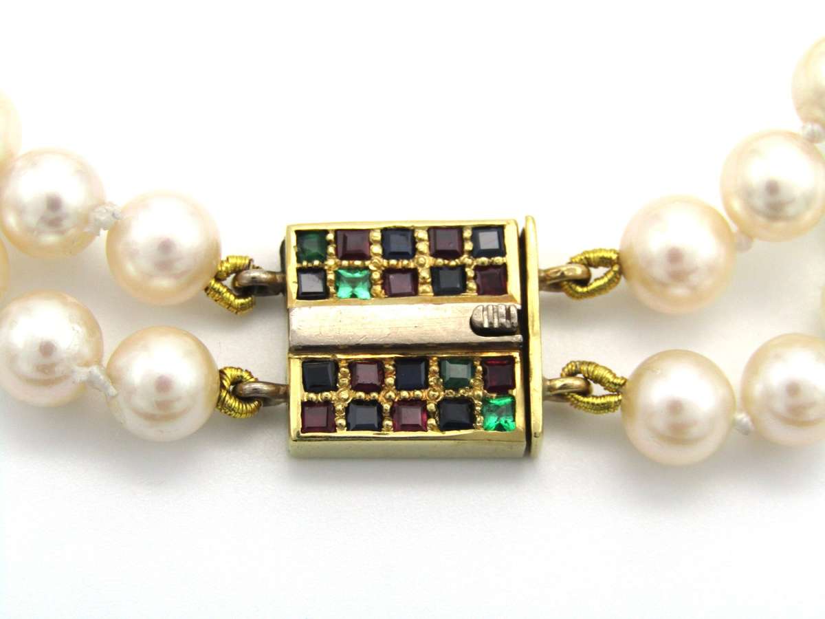 Mid-century, 18K gold double-strand cultured pearl, ruby, sapphire and emerald bracelet
