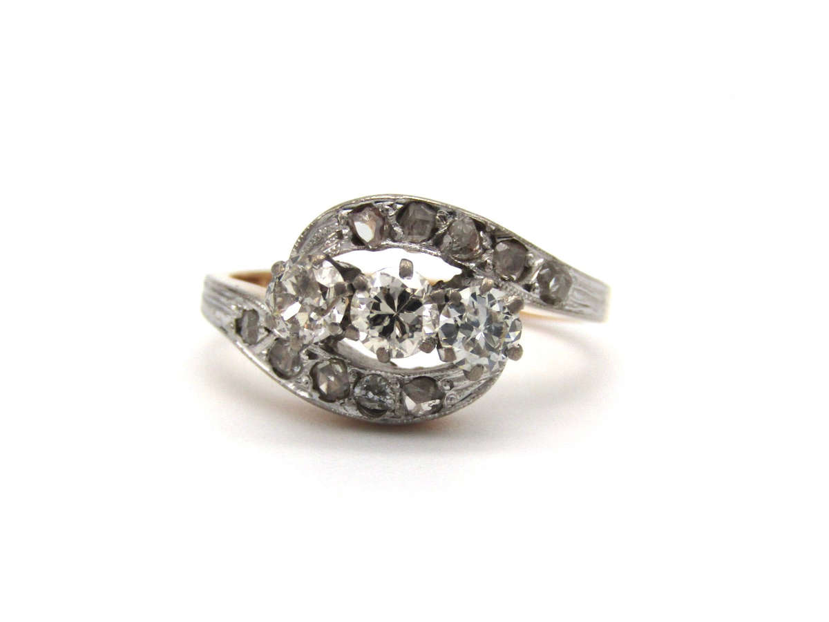 Mid-century, 18K gold trilogy diamond bypass ring