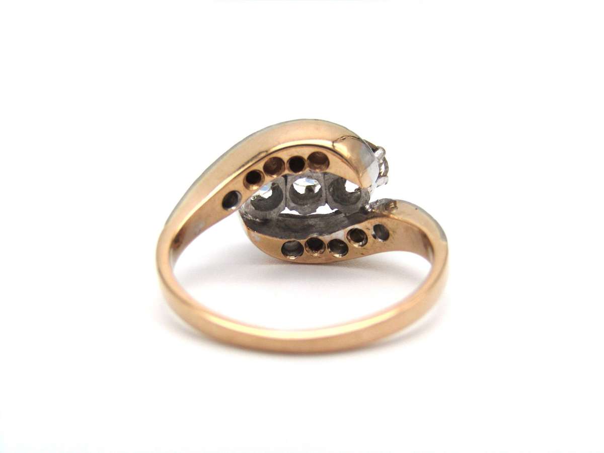 Mid-century, 18K gold trilogy diamond bypass ring