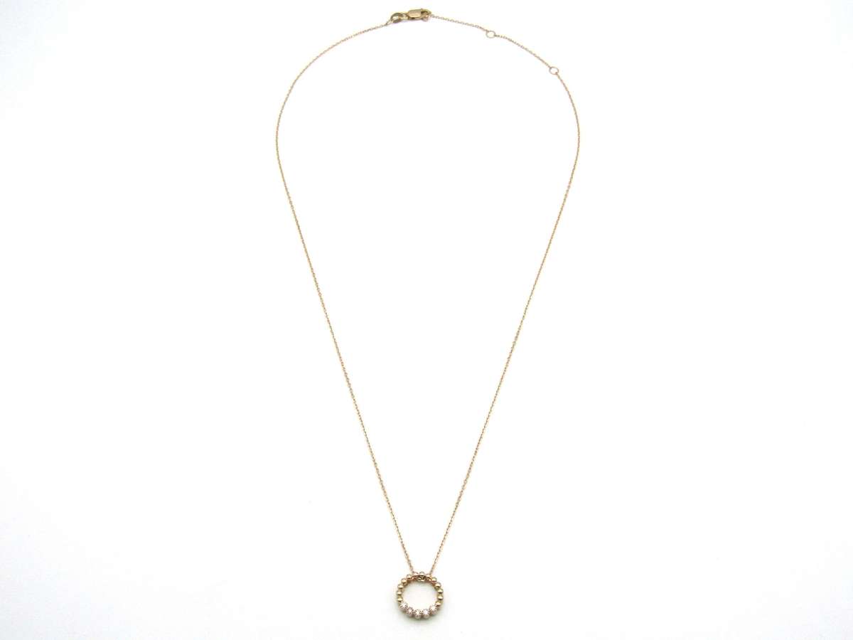 Estate, 9K gold diamond 'circle' pendant