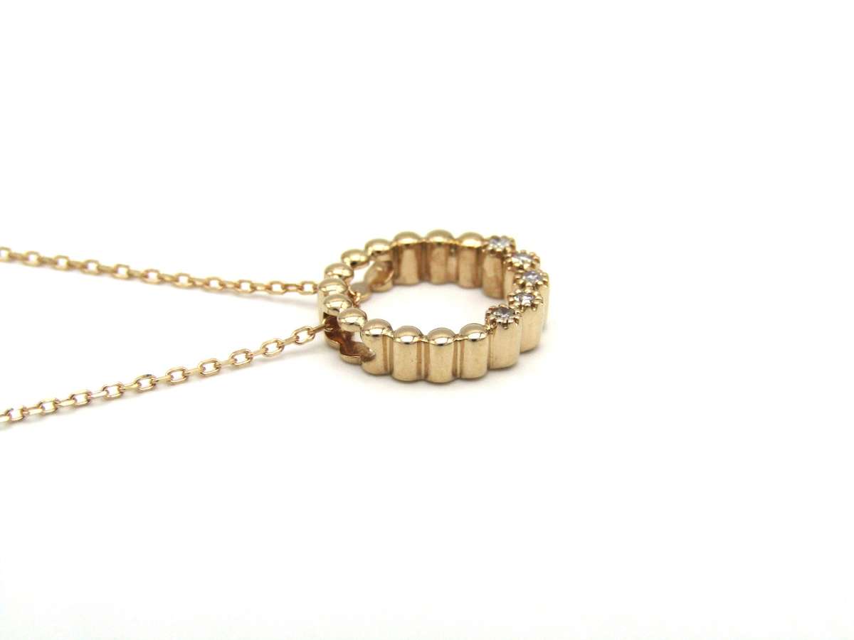 Estate, 9K gold diamond 'circle' pendant