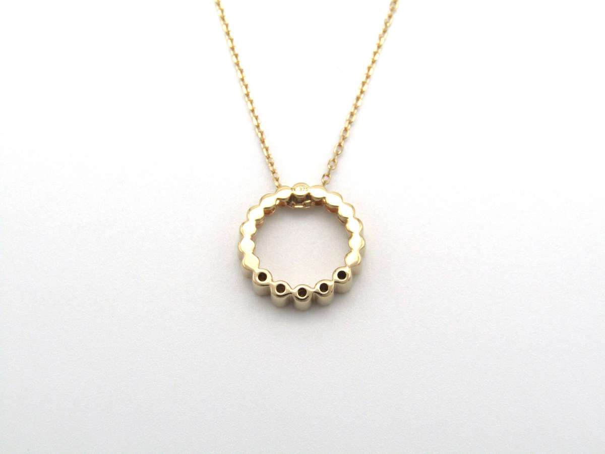 Estate, 9K gold diamond 'circle' pendant