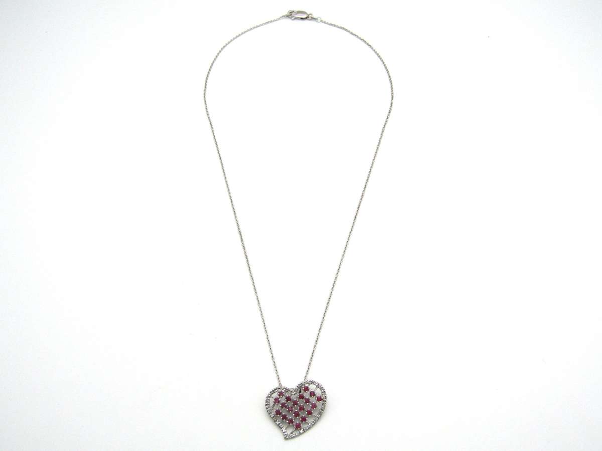 Estate, 9K gold ruby and diamond heart pendant