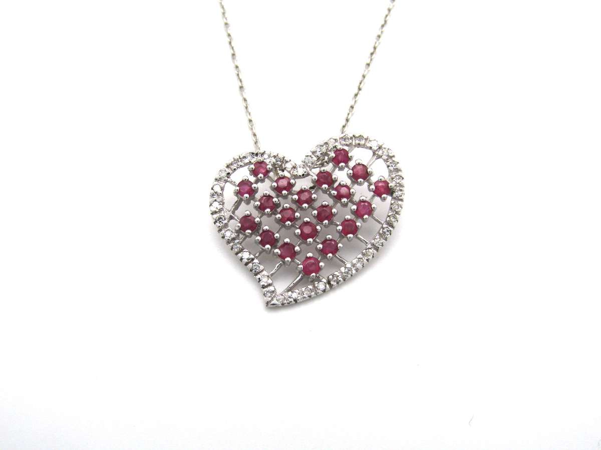 Estate, 9K gold ruby and diamond heart pendant