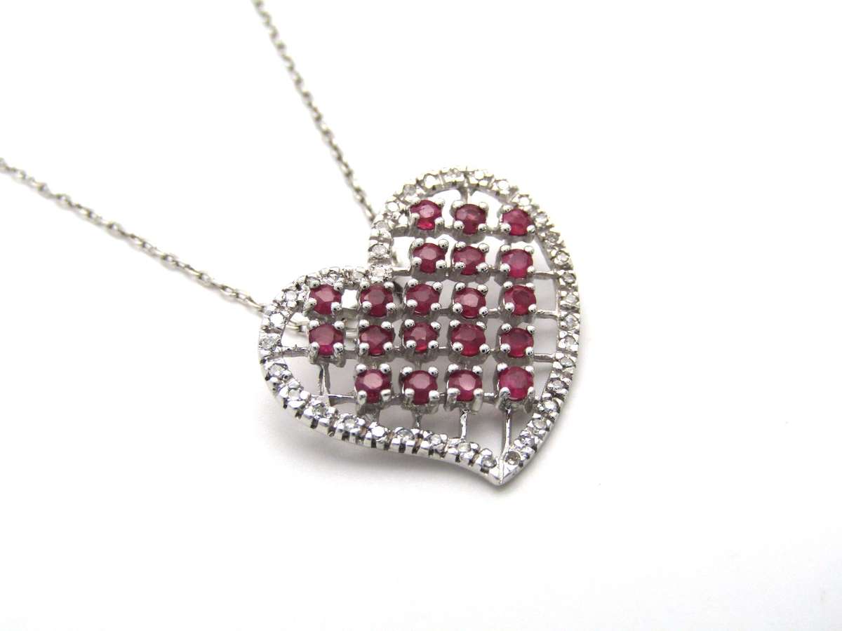 Estate, 9K gold ruby and diamond heart pendant
