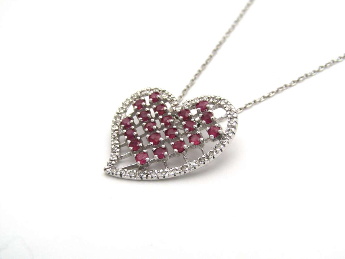 Estate, 9K gold ruby and diamond heart pendant