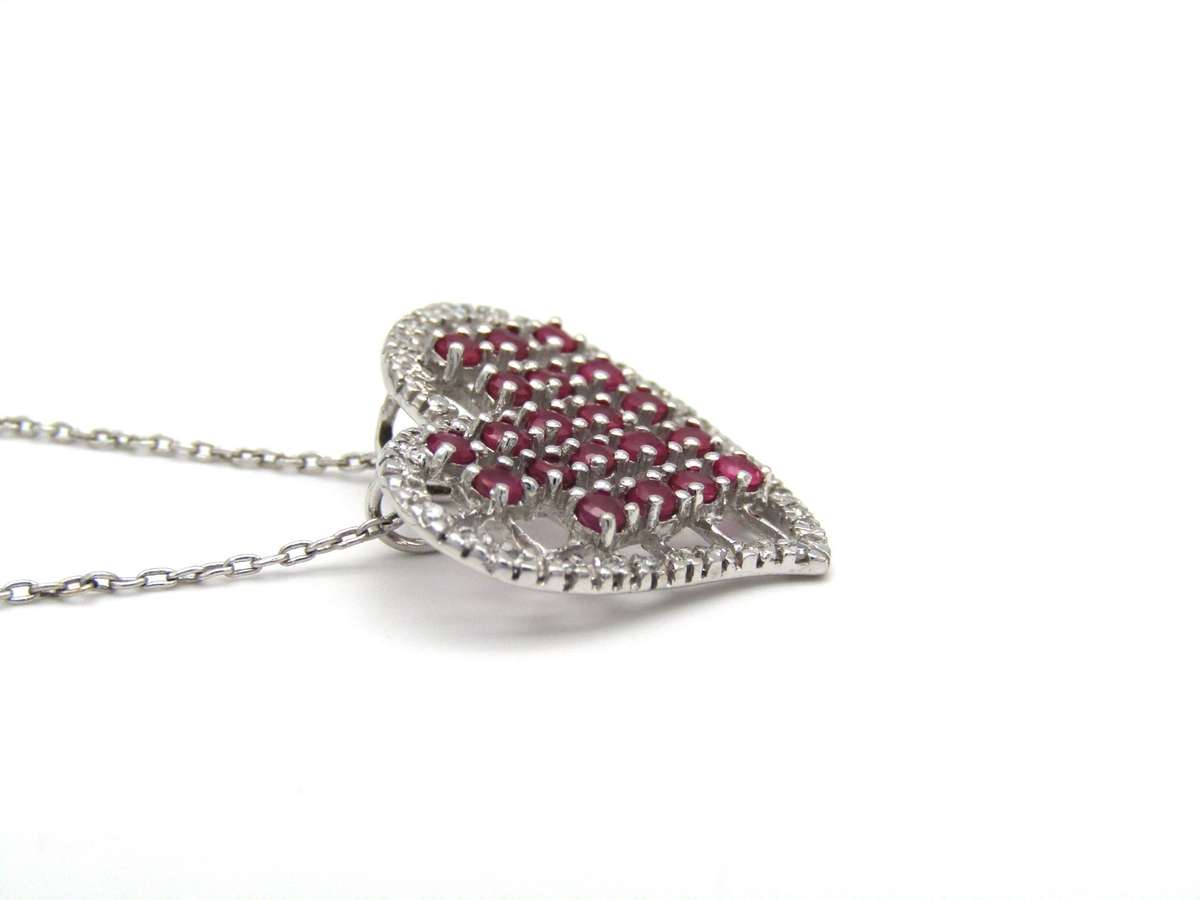 Estate, 9K gold ruby and diamond heart pendant