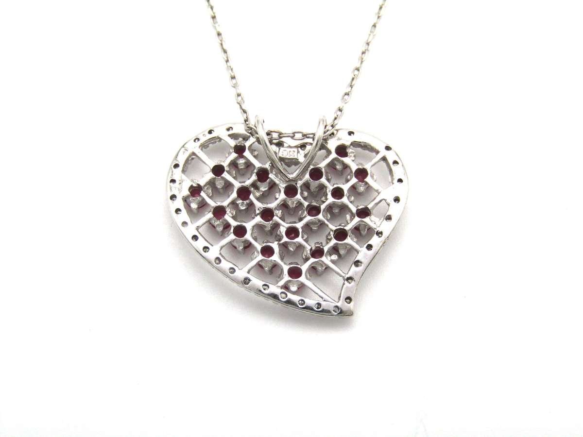 Estate, 9K gold ruby and diamond heart pendant