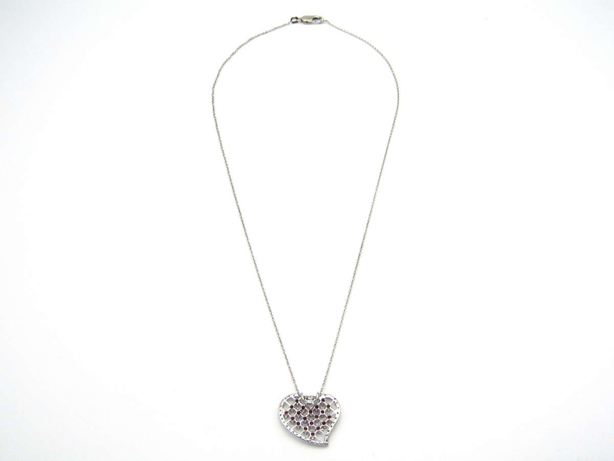 Estate, 9K gold ruby and diamond heart pendant