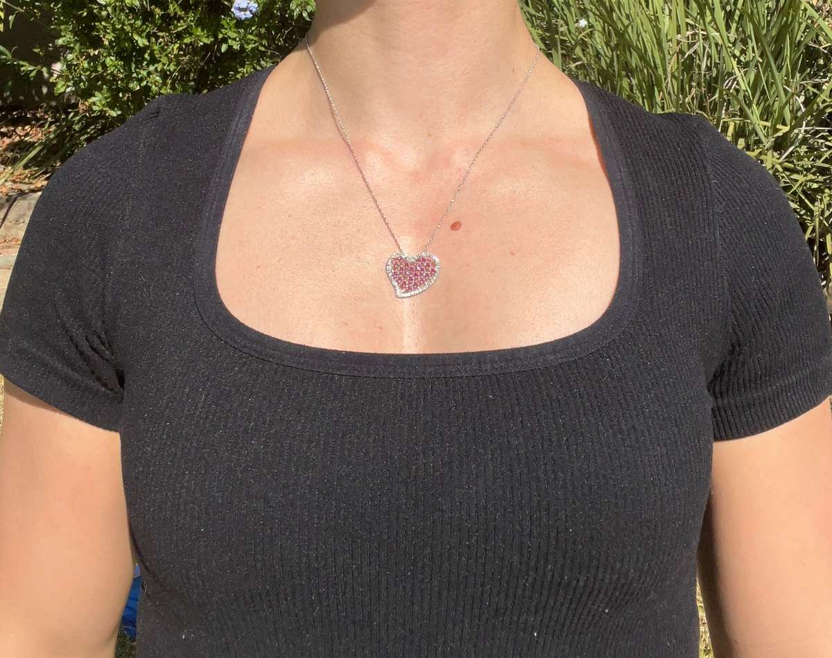 Estate, 9K gold ruby and diamond heart pendant