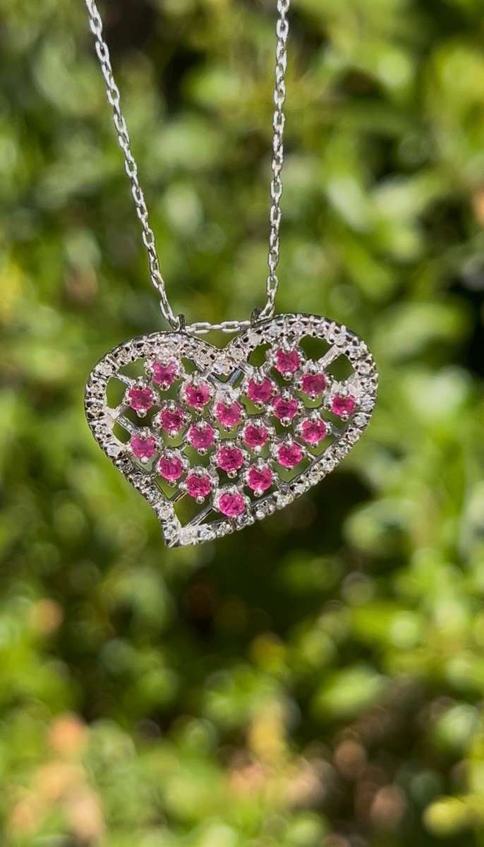 Estate, 9K gold ruby and diamond heart pendant