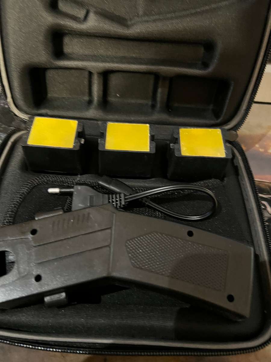 Taser 80KV self-defense shooting stun gun (ballistic taser-style device) in a hard-shell zippered...