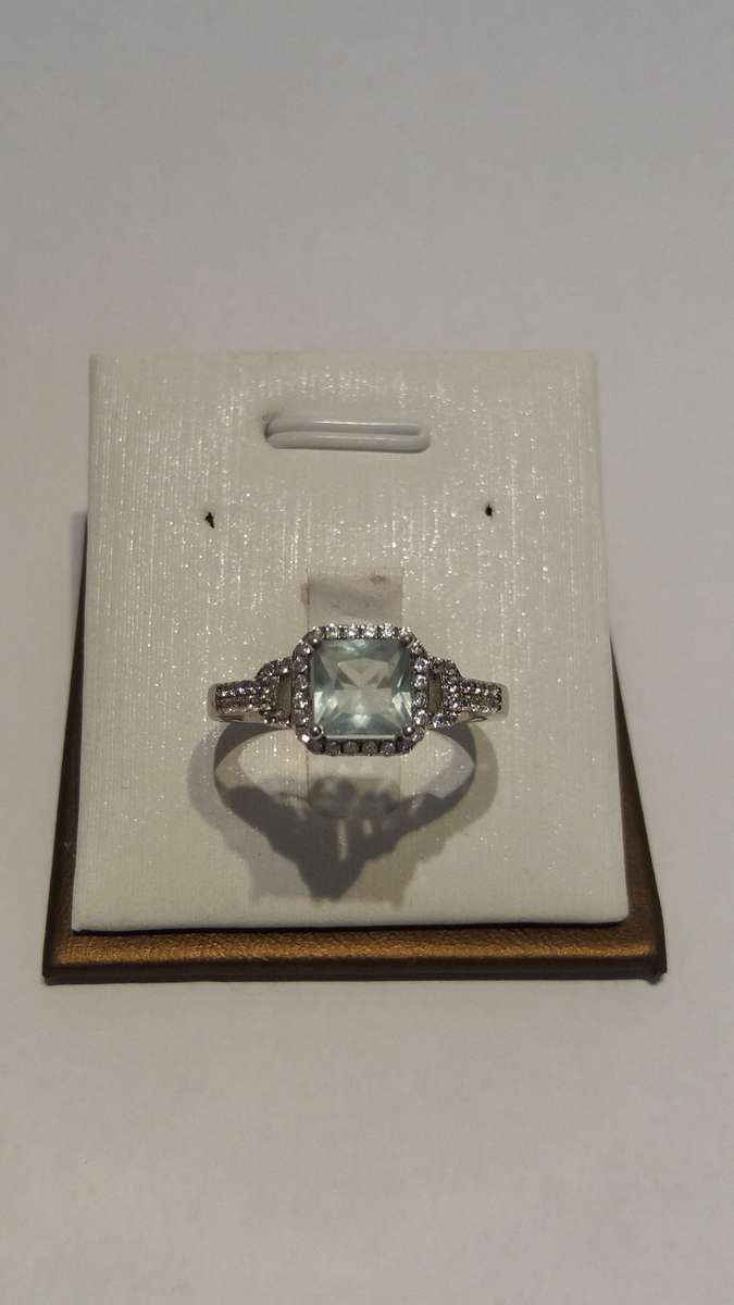 Silver ring with aquamarine and cubic zirconia in a pave setting - R