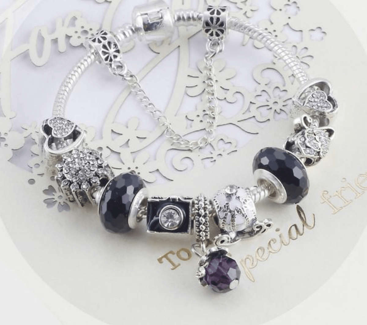 Charming Black and Silver colour bracelet with Heart themed charms - 21cm
