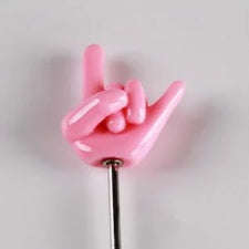 Rock sign cake testing pin. Cake tester