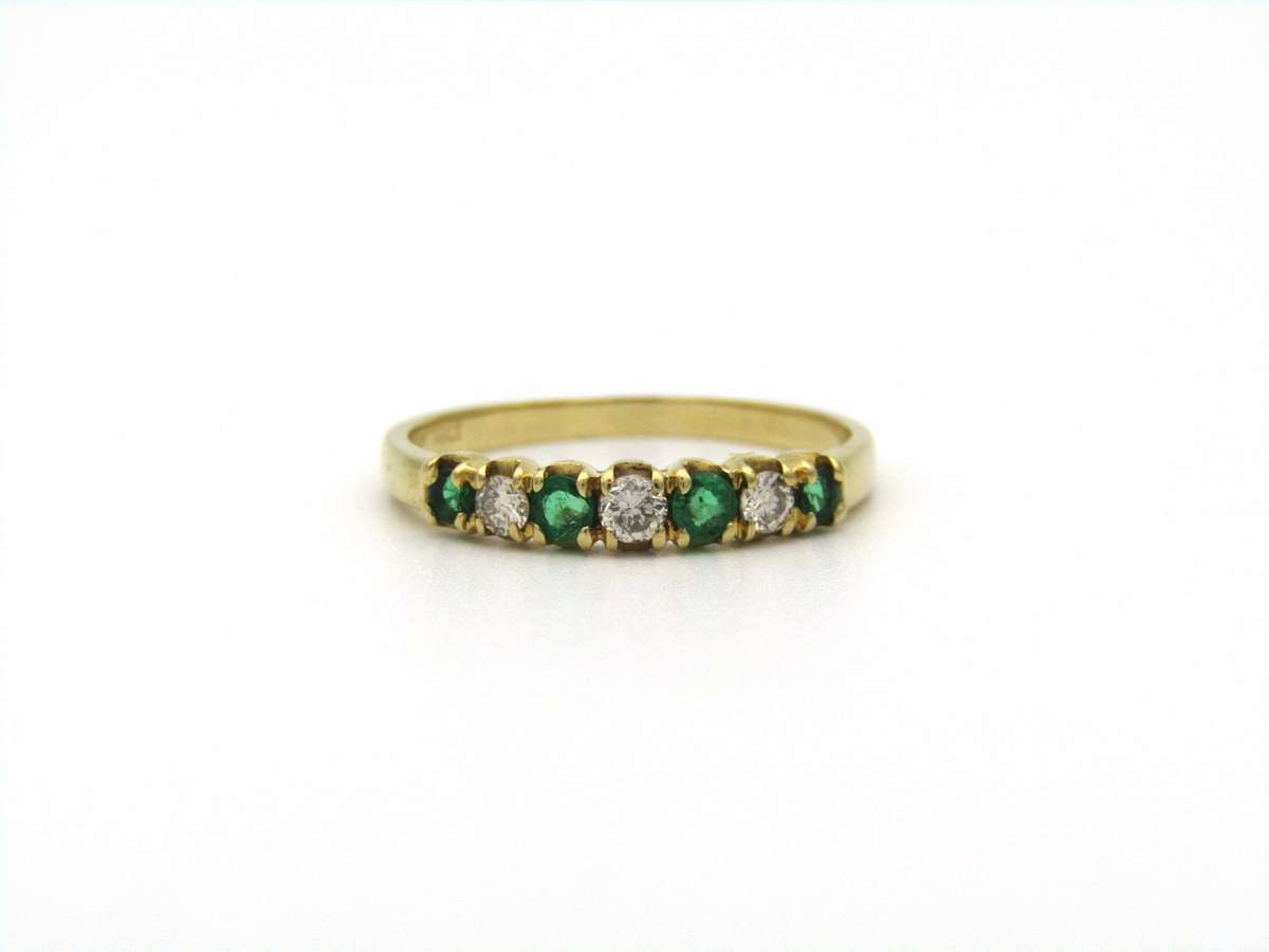 18K gold emerald and diamond ring.