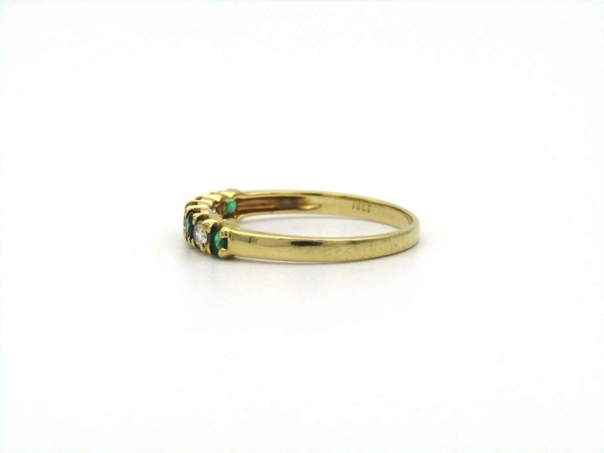 18K gold emerald and diamond ring.
