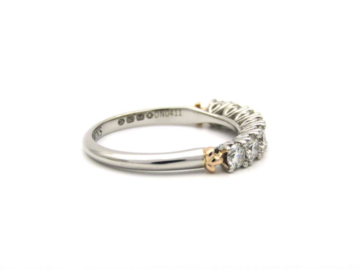 Platinum and 18K gold diamond Protea half eternity ring by Browns.