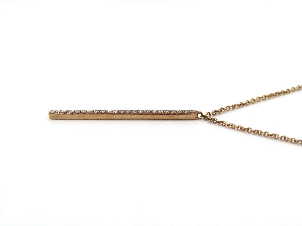 9K gold diamond bar necklace.