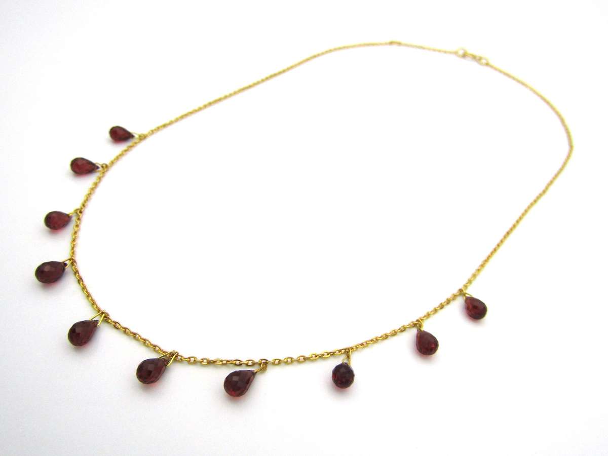 18K gold garnet necklace.