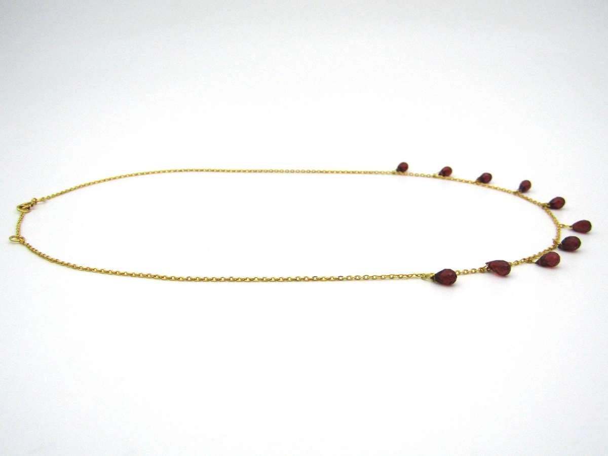 18K gold garnet necklace.