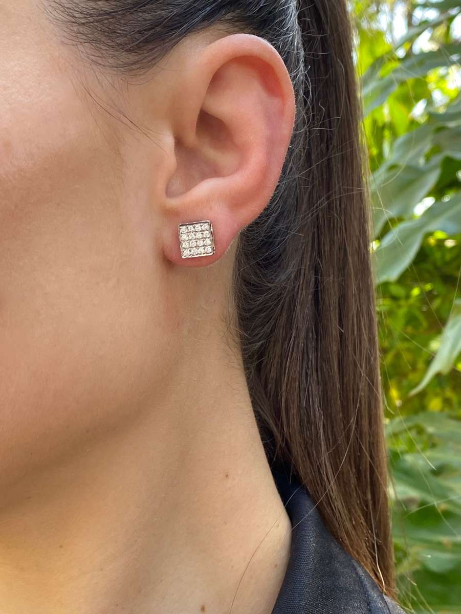 18K gold black and colourless diamond earrings.