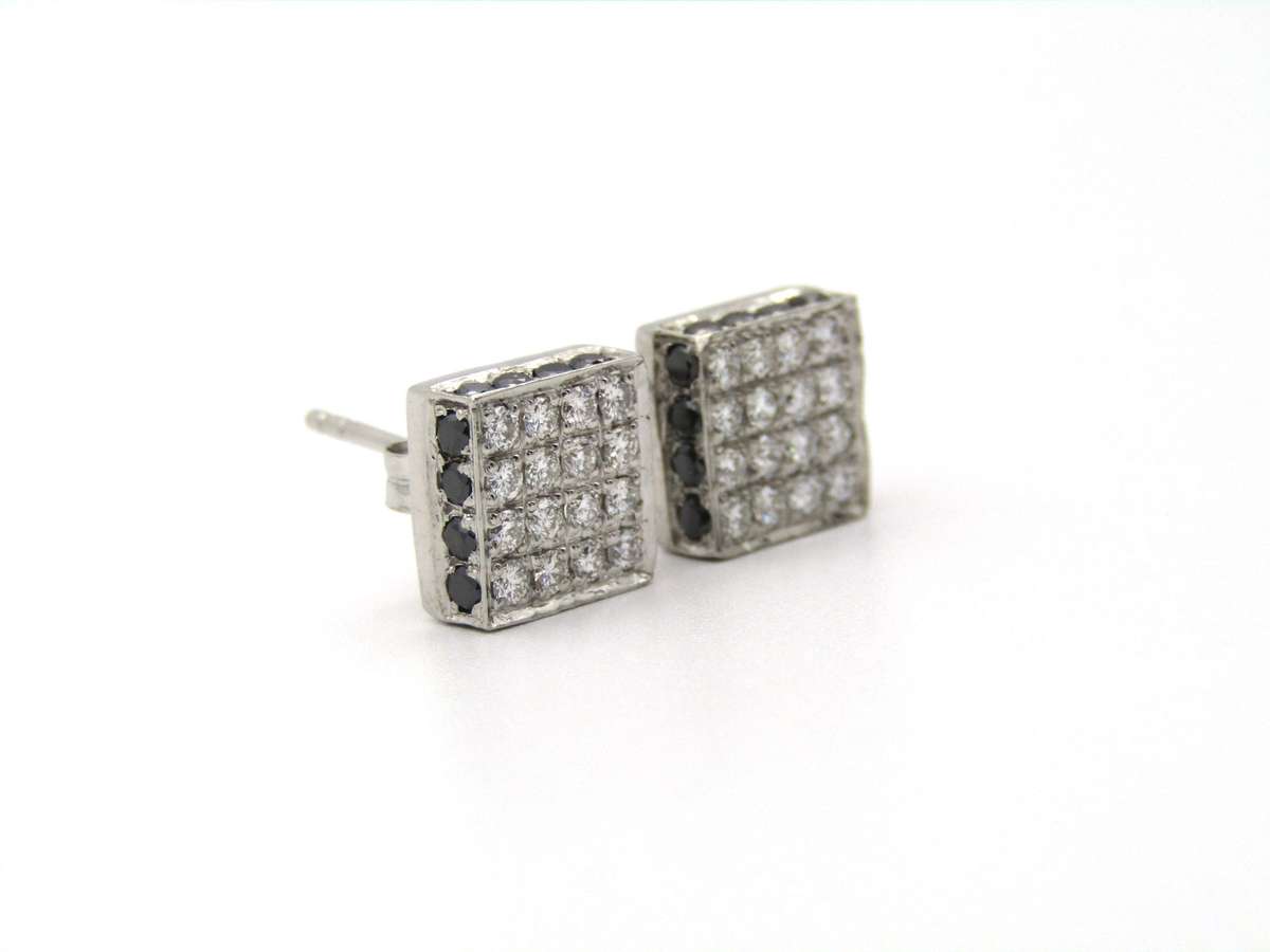 18K gold black and colourless diamond earrings.