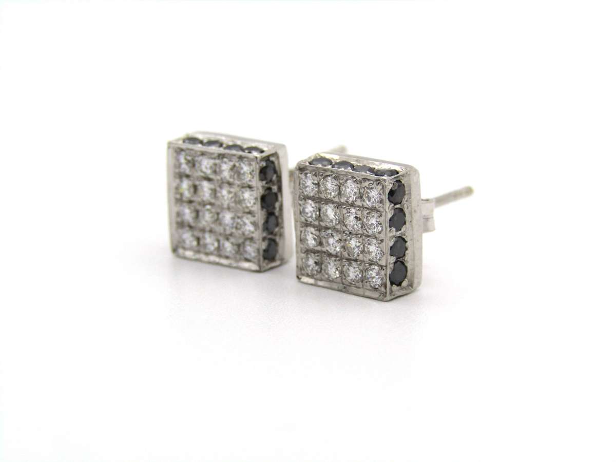18K gold black and colourless diamond earrings.