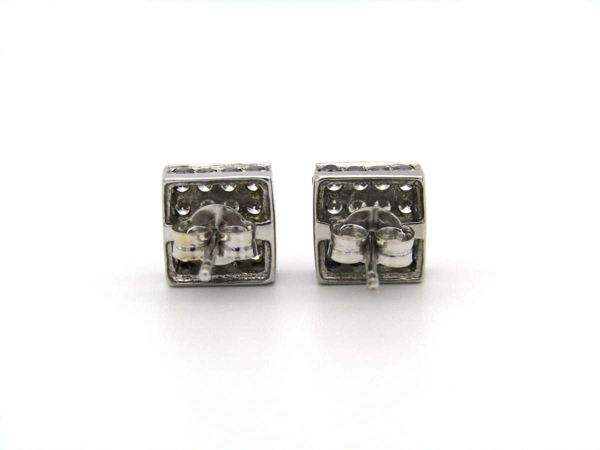 18K gold black and colourless diamond earrings.