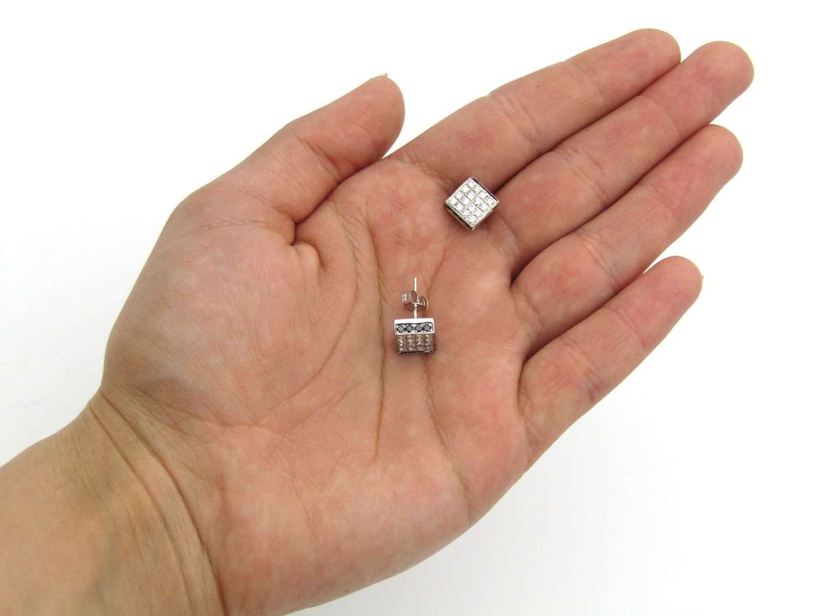 18K gold black and colourless diamond earrings.