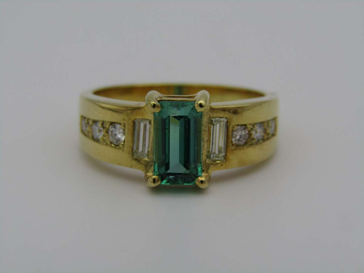 14kt gold emerald and diamond ring.