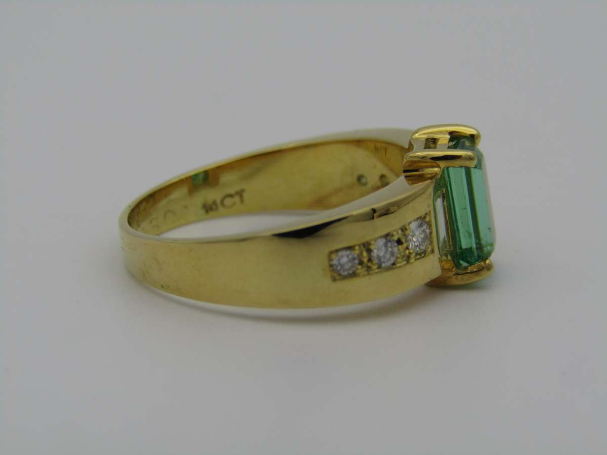 14kt gold emerald and diamond ring.