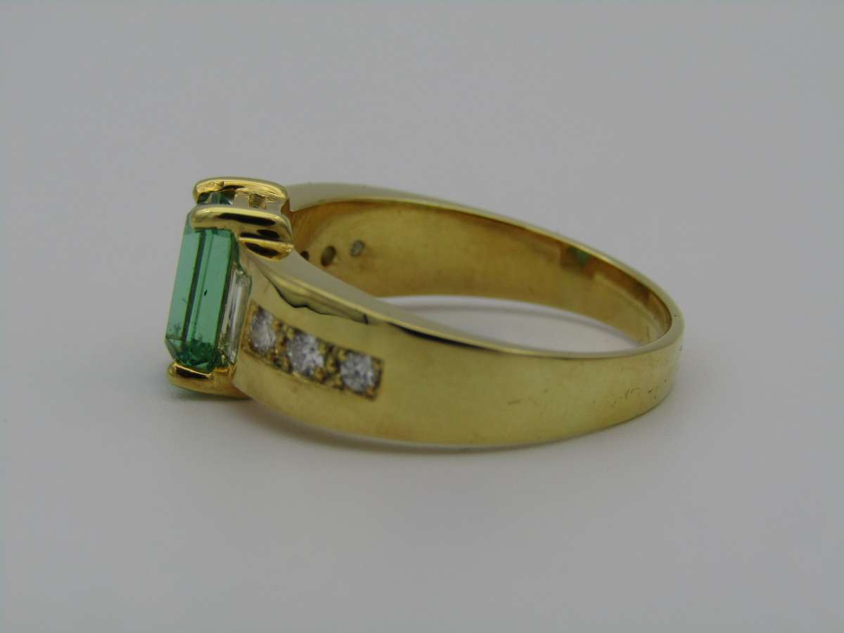 14kt gold emerald and diamond ring.