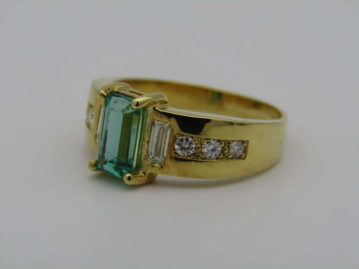 14kt gold emerald and diamond ring.